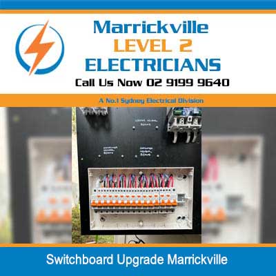 Open electrical switchboard with circuit breakers and wiring during upgrade in Marrickville